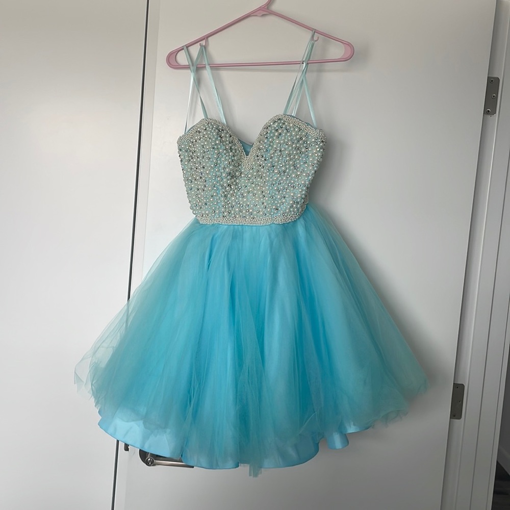 Blue with white and silver beads. Only wore once to prom.  Size 2